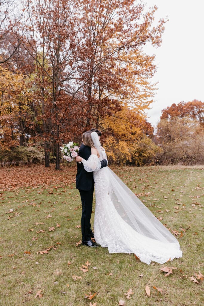 Bride and groom seeing each other for the first time before their Michigan wedding ceremony